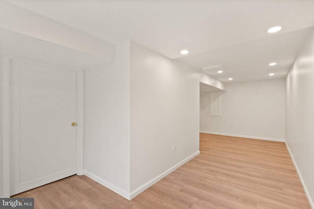 empty room with light hardwood / wood-style floors