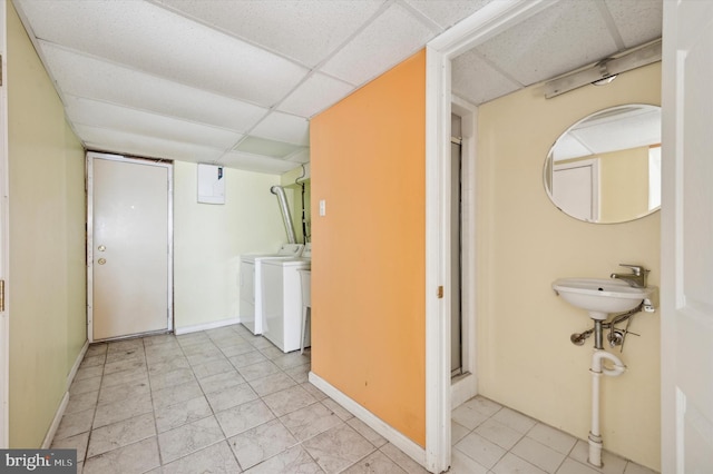 laundry area featuring separate washer and dryer, sink, and electric panel