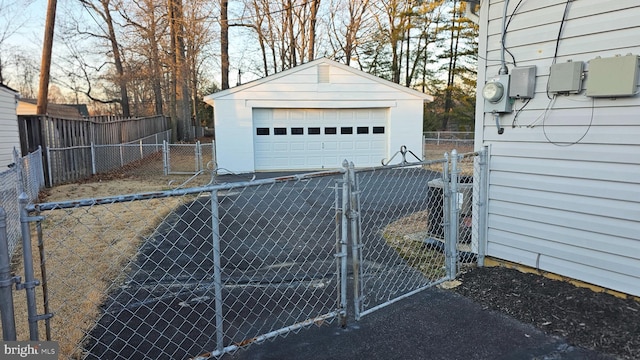 detached garage featuring central air condition unit, a gate, and fence