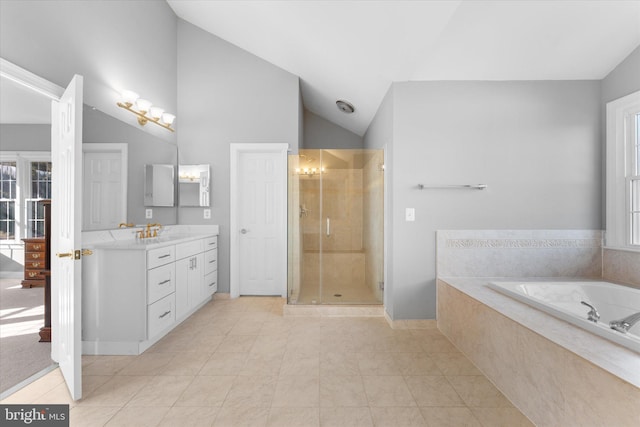 full bathroom featuring a garden tub, tile patterned flooring, vaulted ceiling, vanity, and a shower stall