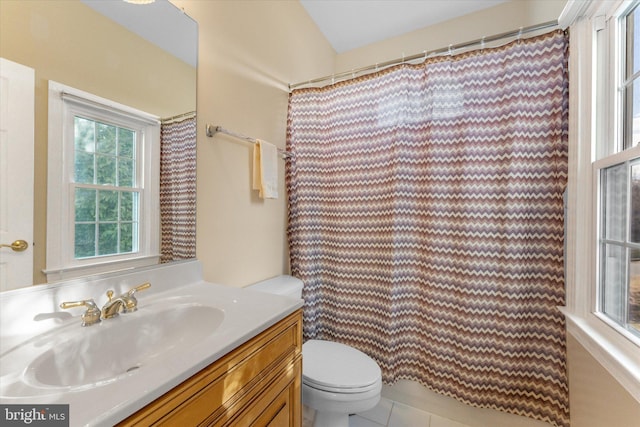 bathroom with a shower with shower curtain, vanity, toilet, and tile patterned floors