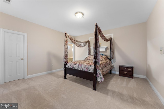 bedroom with carpet, visible vents, and baseboards