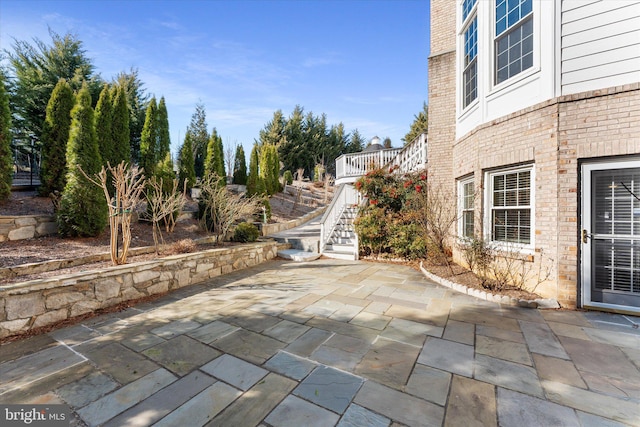 view of patio with stairway