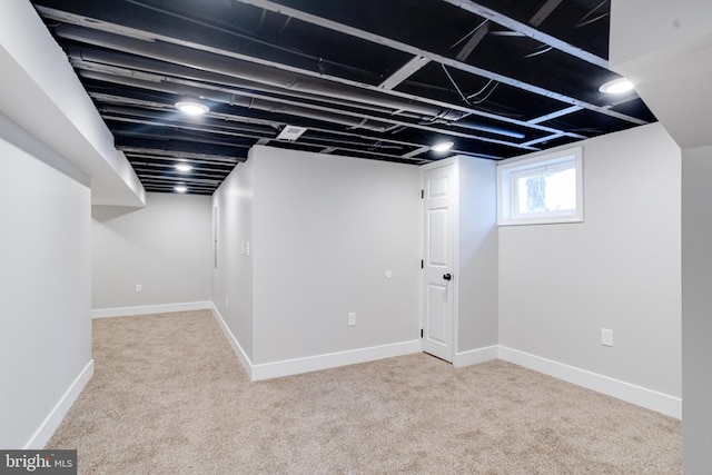 basement with light colored carpet