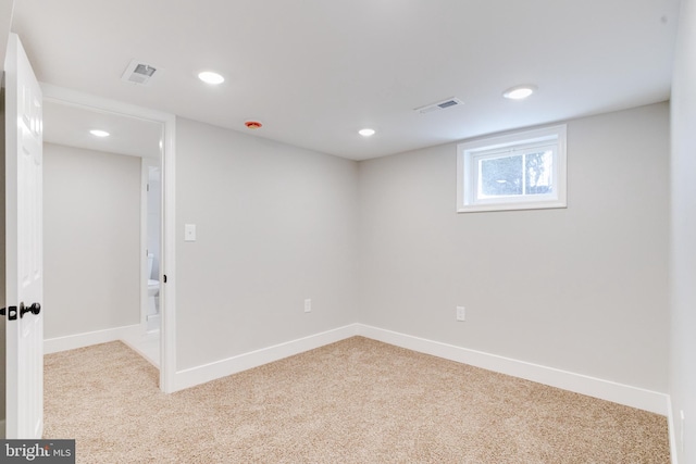 spare room with light carpet