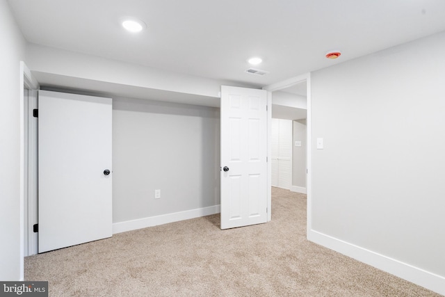 basement with light carpet