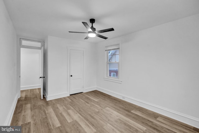 unfurnished bedroom featuring ceiling fan and light hardwood / wood-style floors