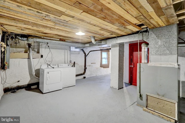 basement with separate washer and dryer, heating unit, and wooden ceiling