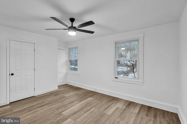 unfurnished bedroom with light hardwood / wood-style floors and ceiling fan