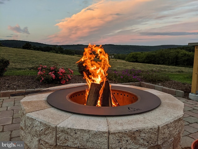 exterior space featuring an outdoor fire pit