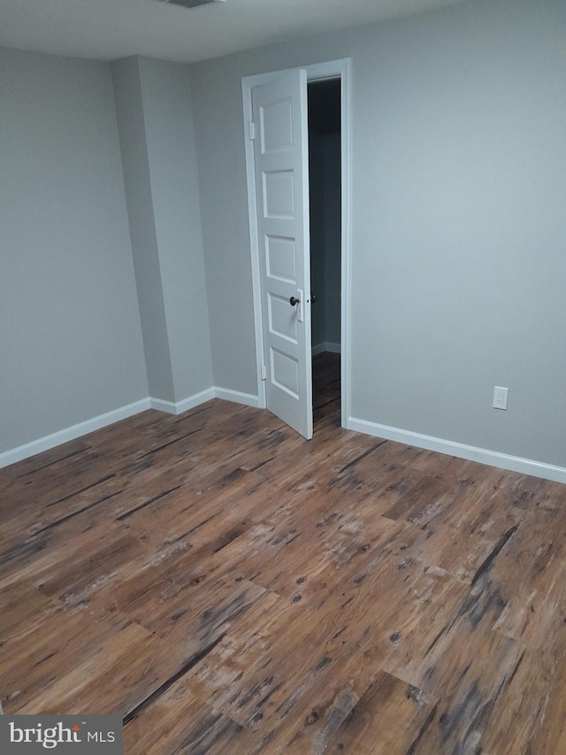 spare room featuring hardwood / wood-style flooring