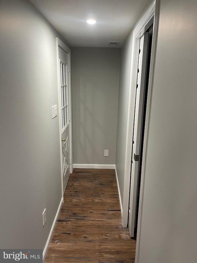 hall with dark hardwood / wood-style floors