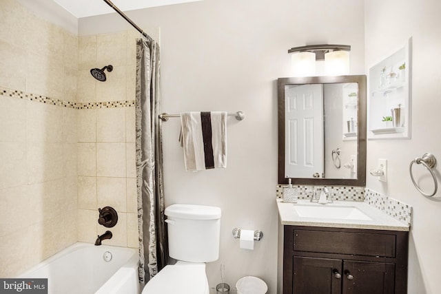 full bathroom featuring vanity, shower / bath combo, and toilet