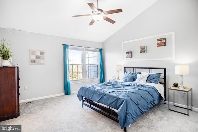 bedroom featuring vaulted ceiling, light carpet, and ceiling fan