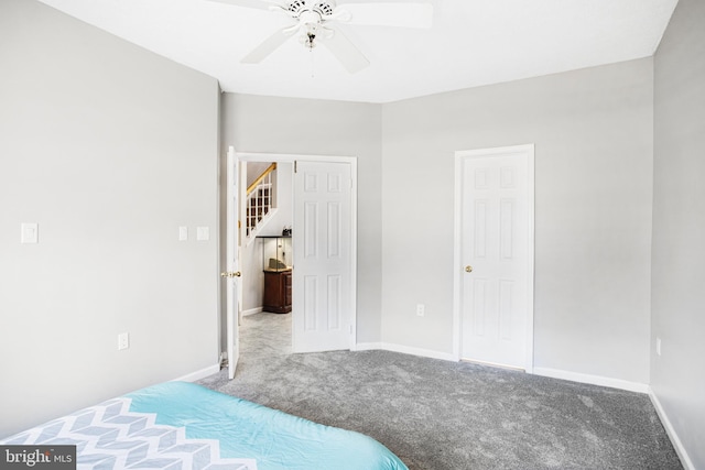 unfurnished bedroom featuring carpet and ceiling fan