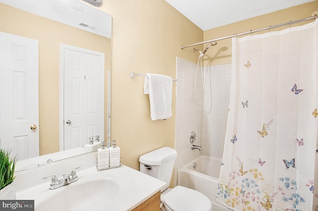 full bathroom featuring vanity, shower / tub combo with curtain, and toilet