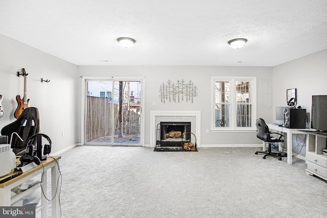 carpeted office space with a textured ceiling