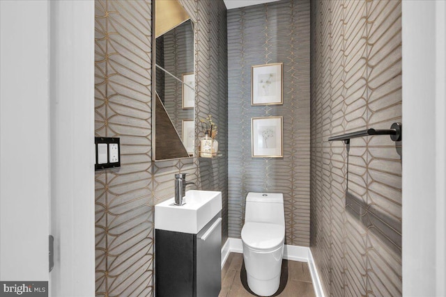 bathroom featuring tile patterned floors, vanity, and toilet