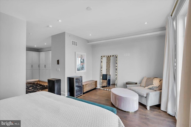 bedroom with dark wood-type flooring