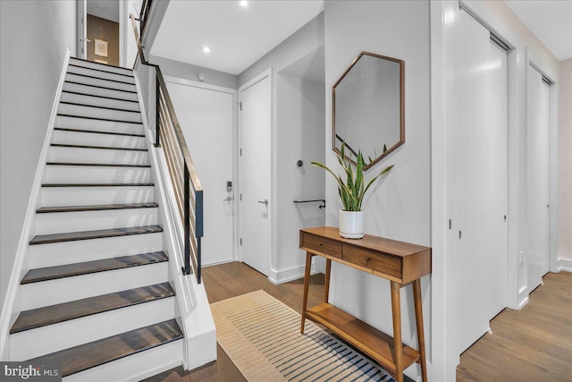 stairway featuring hardwood / wood-style floors