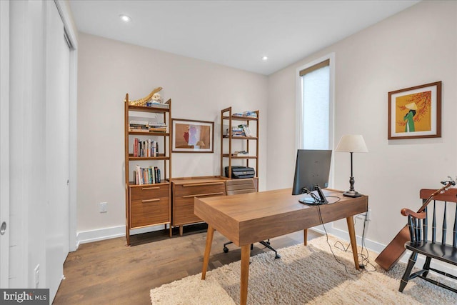 home office featuring hardwood / wood-style floors