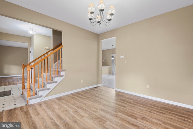 interior space featuring hardwood / wood-style flooring and a chandelier