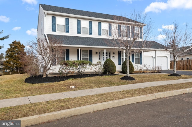 view of front of house featuring a garage and a front yard