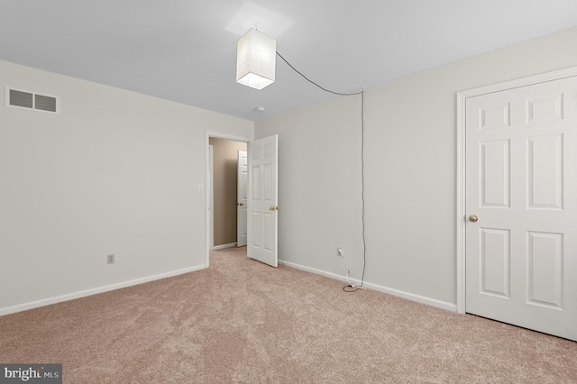 unfurnished bedroom with light carpet