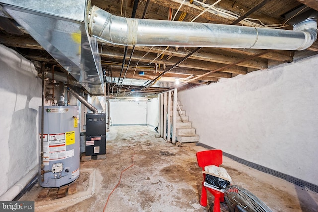 basement featuring heating unit and gas water heater