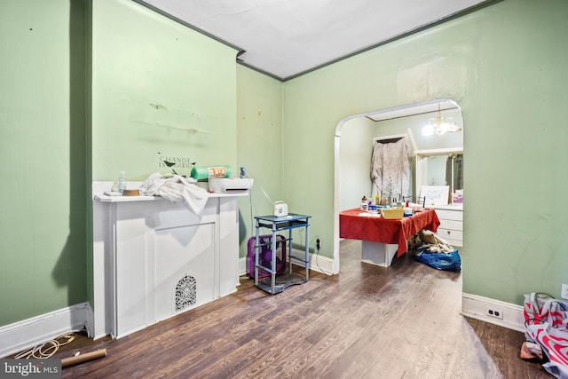 bathroom featuring crown molding and hardwood / wood-style floors