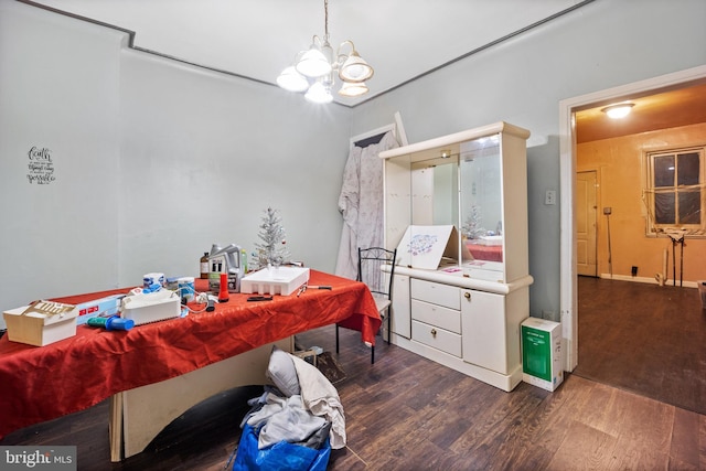 bathroom featuring a notable chandelier and wood-type flooring