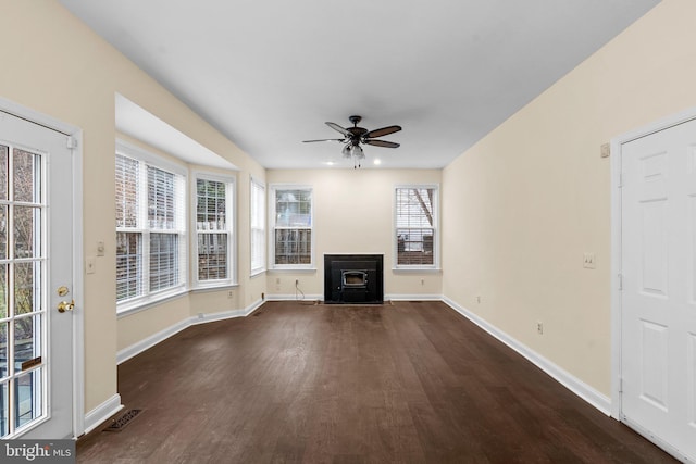 unfurnished living room with dark hardwood / wood-style floors and ceiling fan