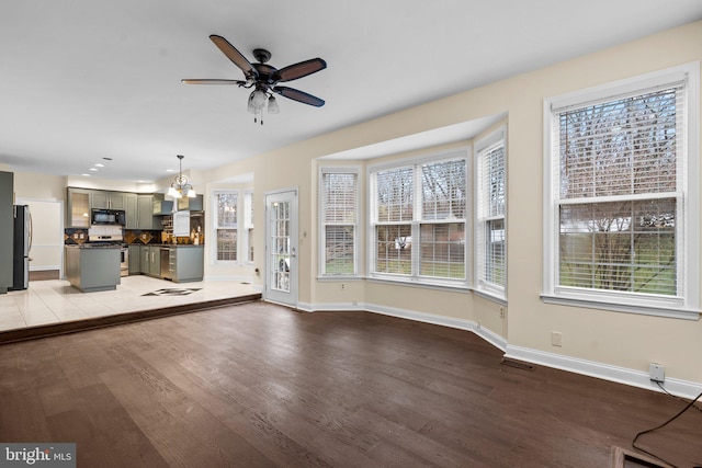 unfurnished living room featuring ceiling fan and light hardwood / wood-style floors