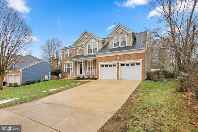 view of front of property with a porch, a garage, and a front yard