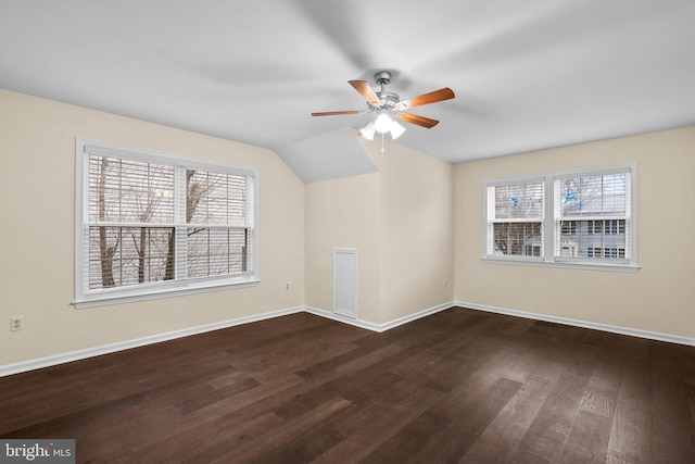 additional living space featuring ceiling fan, lofted ceiling, and dark hardwood / wood-style flooring