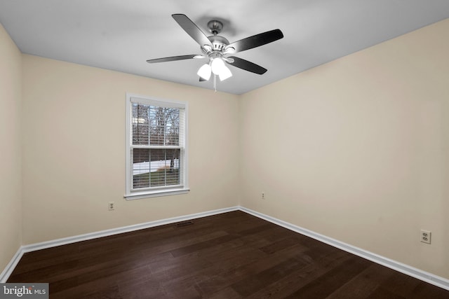 empty room with hardwood / wood-style floors and ceiling fan