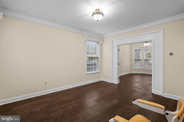 unfurnished room with crown molding and dark hardwood / wood-style floors