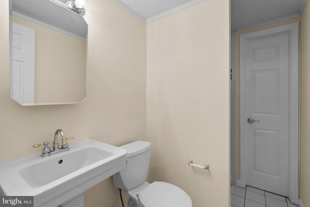 bathroom with sink, ornamental molding, tile patterned floors, and toilet