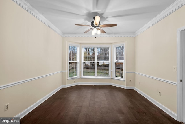 empty room with dark hardwood / wood-style flooring, ornamental molding, and ceiling fan