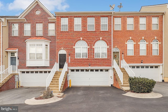 multi unit property featuring a garage