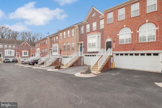 multi unit property featuring a garage