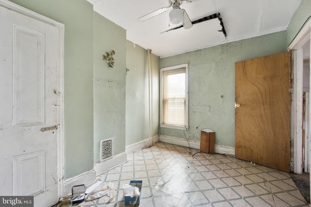 spare room with ceiling fan