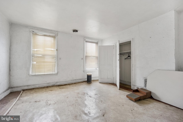 unfurnished bedroom featuring a closet