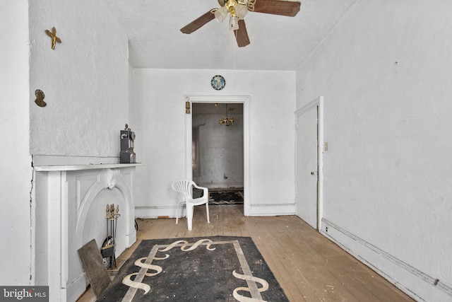 interior space with hardwood / wood-style floors and ceiling fan