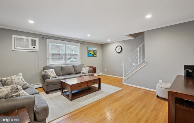 living room with crown molding, light hardwood / wood-style floors, an AC wall unit, and baseboard heating