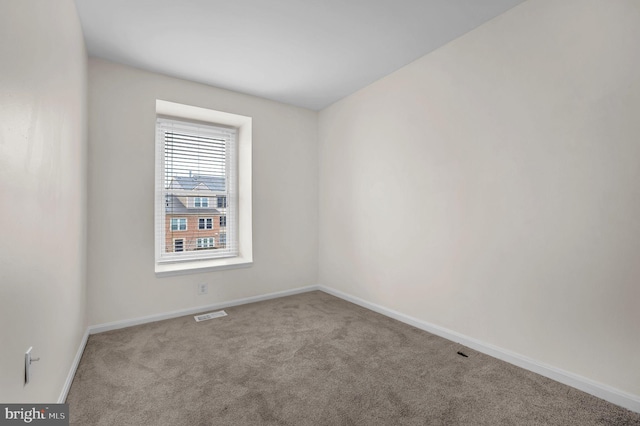 spare room with light carpet