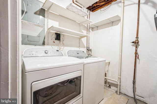 washroom with washing machine and clothes dryer