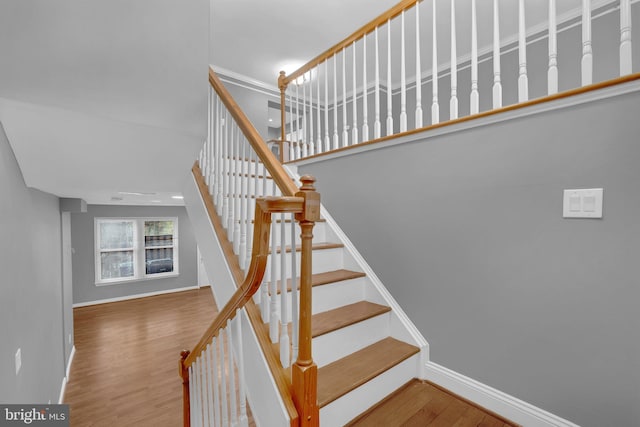 stairway featuring hardwood / wood-style flooring