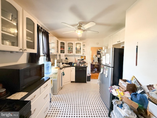 kitchen featuring white cabinetry, ceiling fan, and black appliances