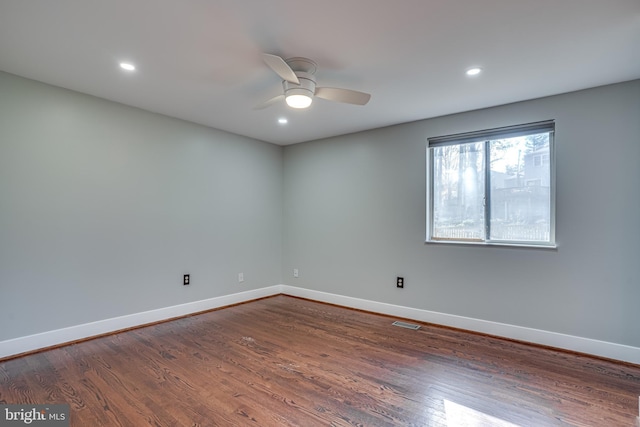 unfurnished room with wood-type flooring and ceiling fan